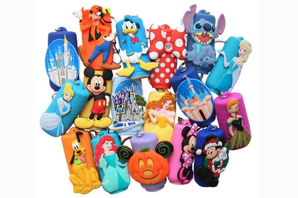 Assorted Disney-themed silicone products including keychains and accessories, produced by a FAMA certified factory with licensed brand cooperation.