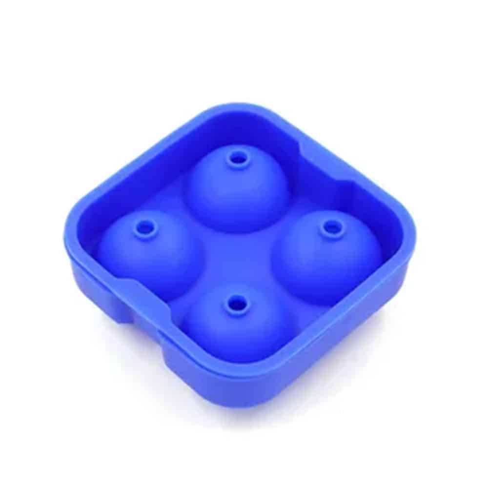 Green silicone table mat designed in the shape of a leaf, placed on a wooden dining table with a plate, fork, and glass, showcasing its food-grade, non-slip, and decorative qualities.