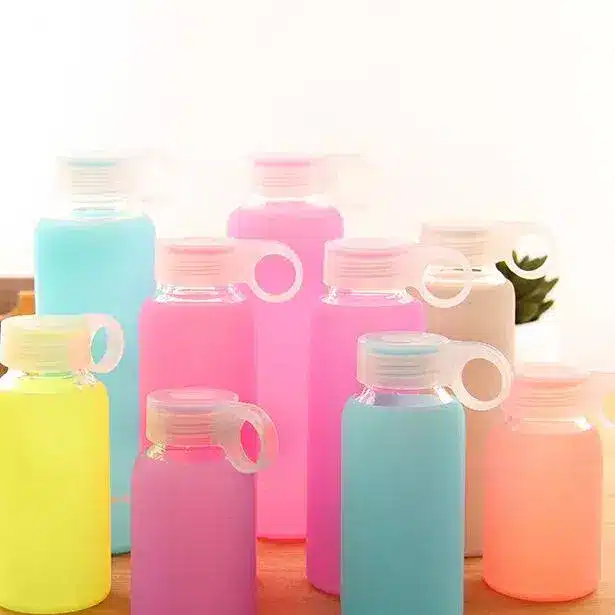 Assorted pastel silicone bottles produced by a Chinese OEM manufacturer for private-label projects.