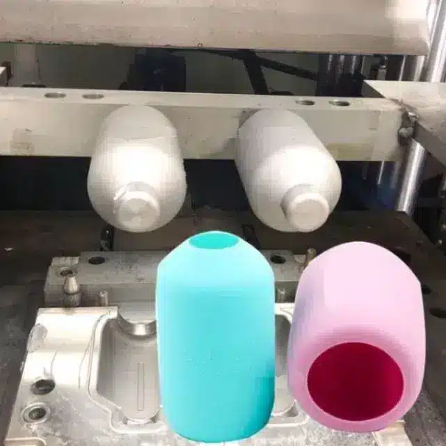 Production mold and silicone sleeves showing how Chinese factories produce high-quality bottles.